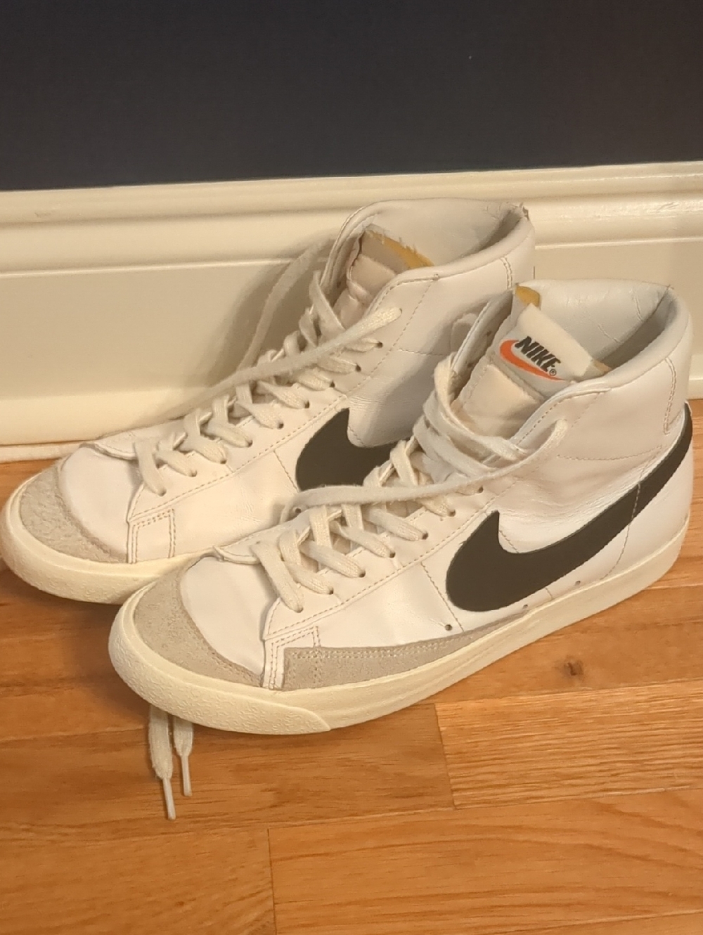 Nike Blazer Mid '77 Vintage white sneakers featuring a black swoosh